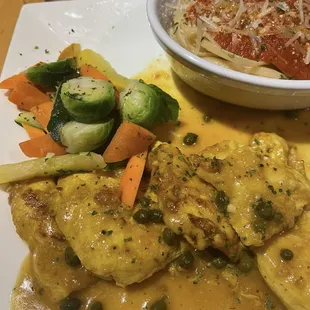 Chicken "Piccata" with pasta and red sauce. Good, but not a piccata.