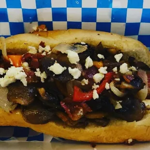 a hot dog with various toppings