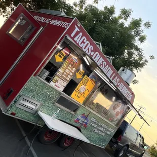 a taco truck parked in a parking lot
