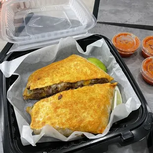 a sandwich in a styrofoam container