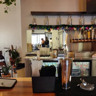 View behind the bar towards the kitchen preparation area