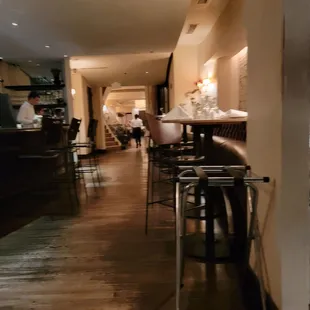 a view of a restaurant with bar stools