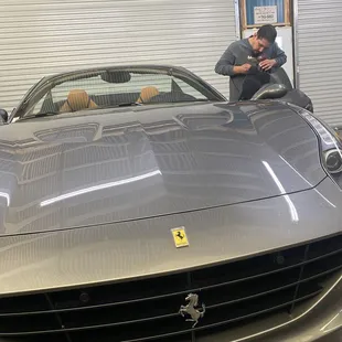 Charlie applying Vortex IR nano ceramic tint to Ferrari @ Matrix Auto Glass and Tint