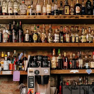 a shelf of liquor bottles