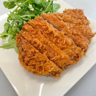 Pork Katsu.  Cutlet served with sweet and savory sauce.