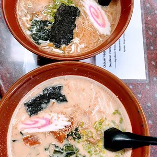 two bowls of soup on a table