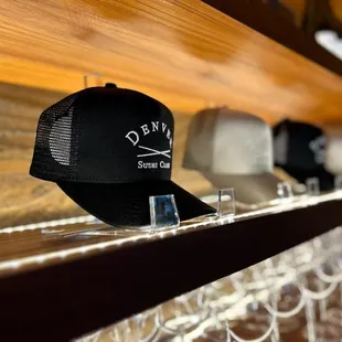 a row of hats on a shelf