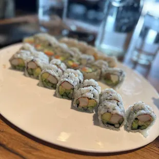 a plate of sushi rolls