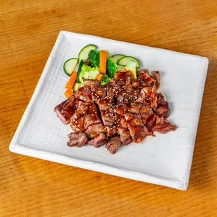 a plate of meat and vegetables