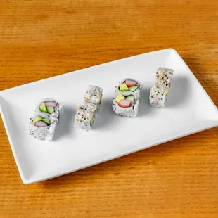 a plate of sushi rolls
