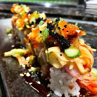 DINKY 14.95 [shrimp tempura, spicy tuna] Hamachi, onions, jalapeño, asparagus, spicy aioli, unagi sauce, garlic chip &amp; tobiko