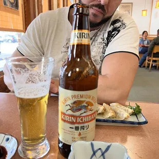 a man drinking a beer