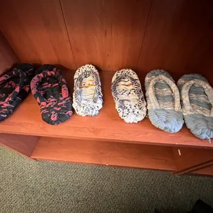 three pairs of slippers