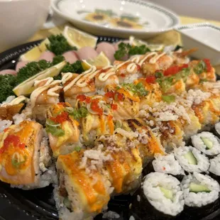 a plate of sushi rolls