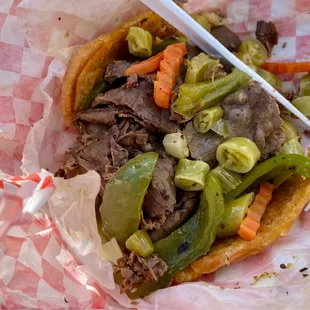 Half hot beef and half sausage with jus on the side (keeps bread sturdier)