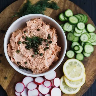 Smoked salmon dip with capers, sliced organic veggies and warm bread.