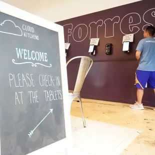 a man standing in front of a chalkboard