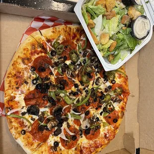 16&quot; Large pizza with pepperoni beef mushroom onion green pepper and half jalapeño peppers along with a large Caesar salad
