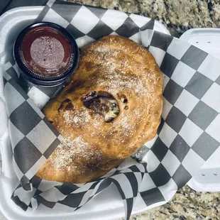 Custom calzone. Italian sausage, Canadian bacon, onion, black olives.