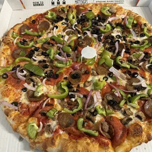 Lots of toppings ( Al Dente) including green peppers that were not supposed to be included, the sausage has a little kick which is yummy.