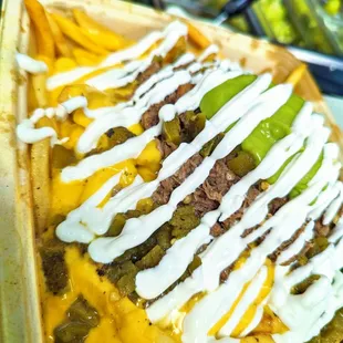 a plate of nachos with cheese sauce