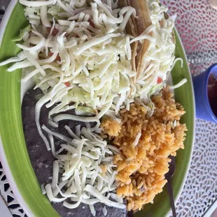 2 taco lunch special. Why are the beans black/purple? No flavor, watery. Terrible.
