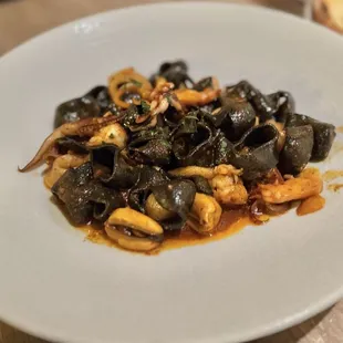 Calamarata  - squid ink scented pasta, scallops, calamari, shrimp, mussels, calabrian n&apos;duja sauce. 5/5