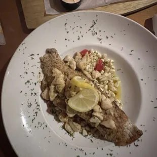 Rockfish &amp; lump crab over roasted corn slaw with garlic butter glaze