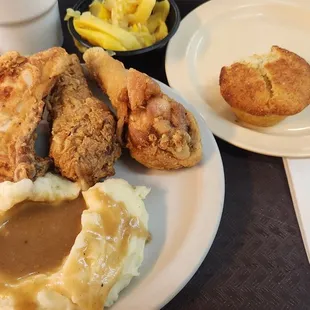 Fried chicken, squash, mashed potatoes and gravy, cornbread