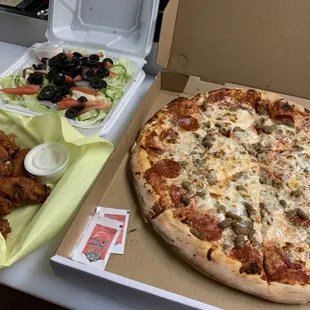 Our Very Popular Pizza Special!    Large Pizza (2 Topping) Large Salad, 12 Wings!