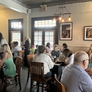 a large group of people sitting at tables