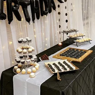 a black and white dessert table