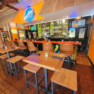 Small bar near main entrance. Also, pickup your food takeout orders from bartender (DoorDash, etc)