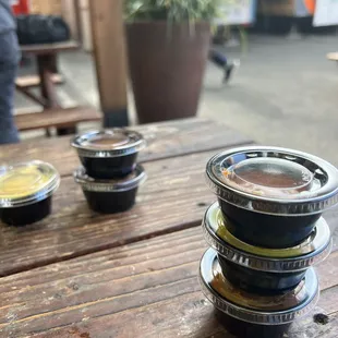three cups of coffee on a wooden table