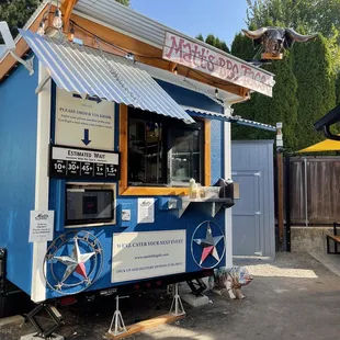 a blue and yellow food cart