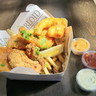 Sampler basket: 2 flaky cod, 2 massive shrimp, 2 juicy oysters, lots of fries.