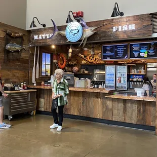 a woman standing in front of the counter