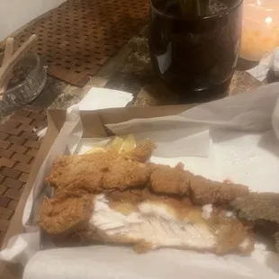 a plate of fried fish