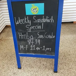 a blackboard with a price list on it