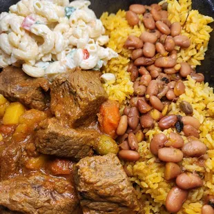 Beef stew with yellow rice red beans &amp; mac