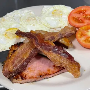 Triple play breakfast. Comes with ham, bacon, sausage, three eggs and two sides.