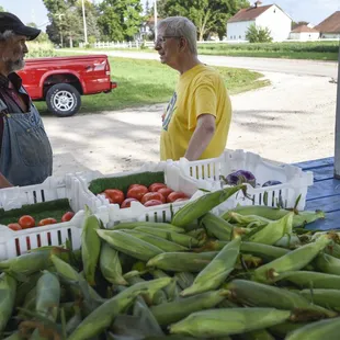 a man and a woman at a farmers market