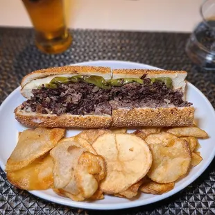 Matu Philly Cheesesteak- Wagyu Ribeye &amp; Sirloin,  Cooper Sharp Cheese with Grilled Onions and Roasted Long Hit Pepper on Baked Sesame Roll.