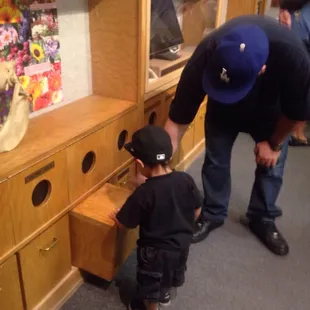 Lil Rey with his uncle checking out shells.