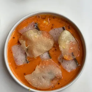 a bowl of soup with meat and vegetables