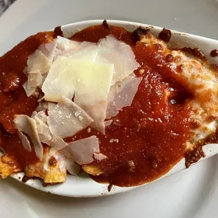 a piece of lasagna on a white plate