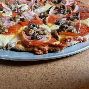 a pizza with meat and cheese