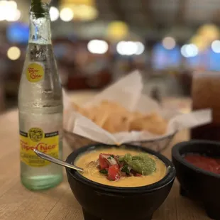 Loaded queso and a cold Topo!