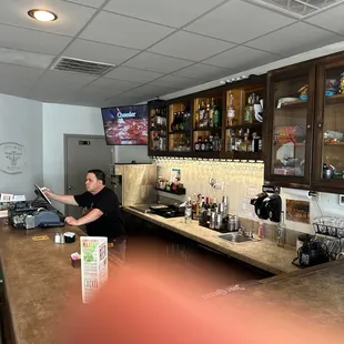 a bartender at the bar