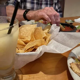 a man sitting at a table with food